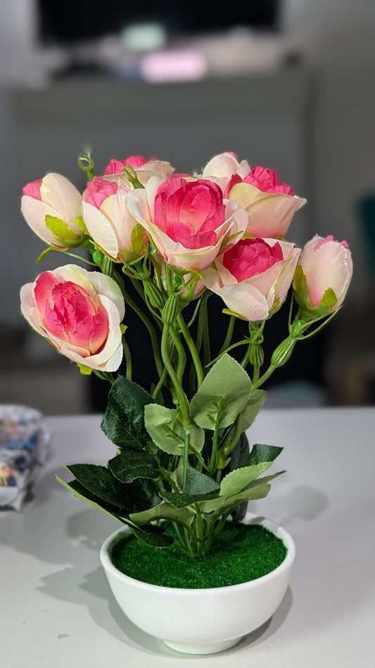 Pink rose stalks with vase